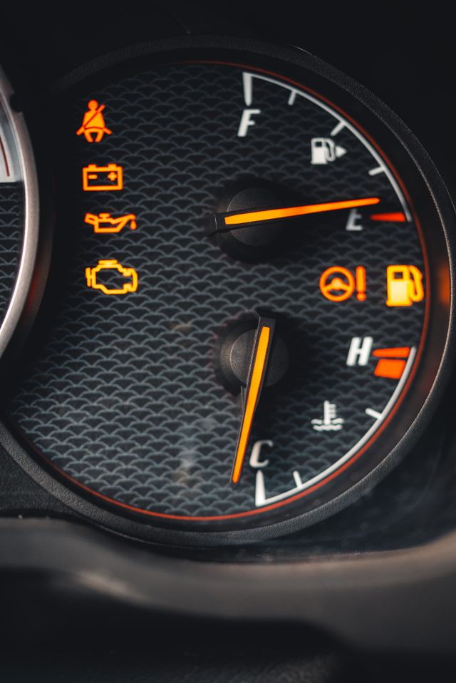 Dashboard warning lights explained — engine management, battery, and tyre pressure symbols on a car dashboard at Homerton Car Repairs, Hackney.
