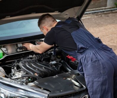 Diagnosing an intermittent electrical fault with a multimeter at Homerton Car Repairs in Hackney, East London.